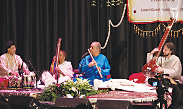 Pandit Hariprasad Chaurasia (wearing blue) performs on the bansuri, the north Indian bamboo flute, at LearnQuest's 2008 Indian Classical Music Conference.